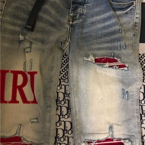 AMIRI Light Blue Distressed Jeans with Red Accents